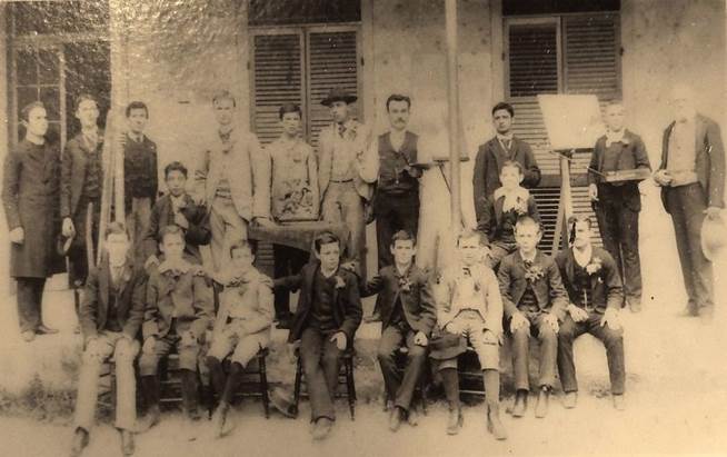 A group of people posing for a photo
Description automatically generated